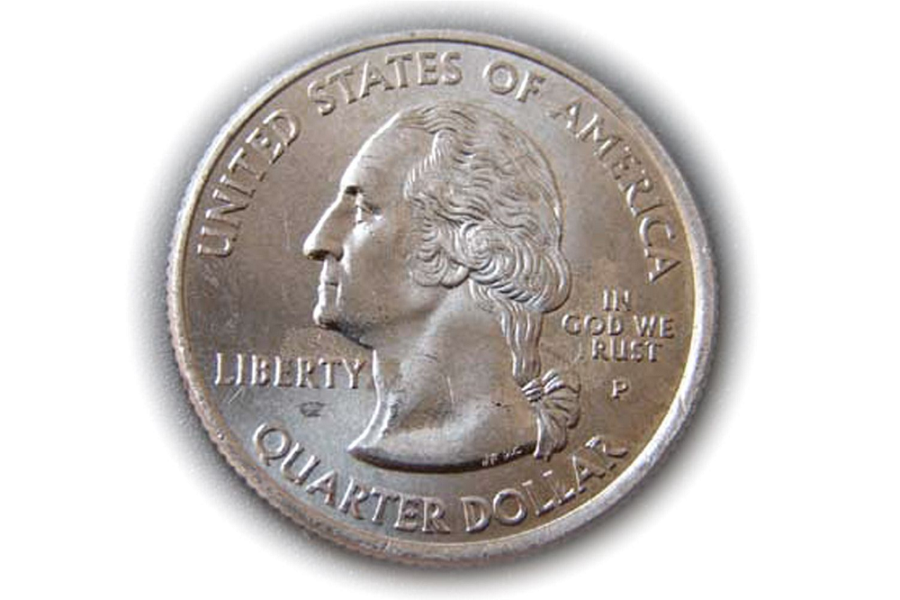 Close-up of 2005-P Kansas quarter reverse showing 'IN GOD WE RUST' error with missing T in TRUST